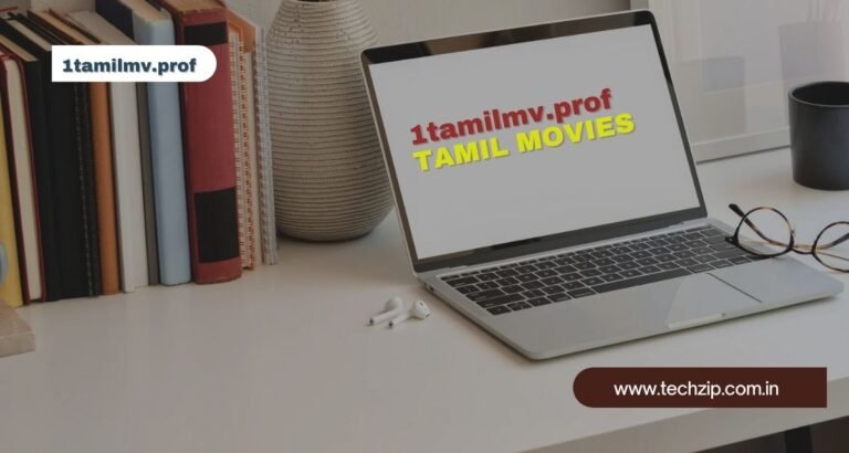 Laptop displaying 1tamilmv.prof website for Tamil movies on a desk next to books